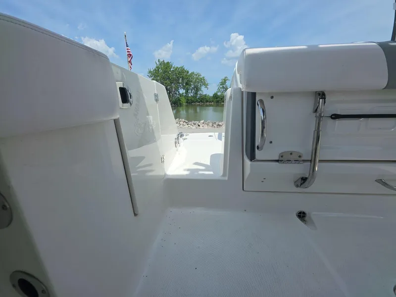 Slide: The Image of 2021 Robalo R272 Center Console boat interior with seating and water view. - 15