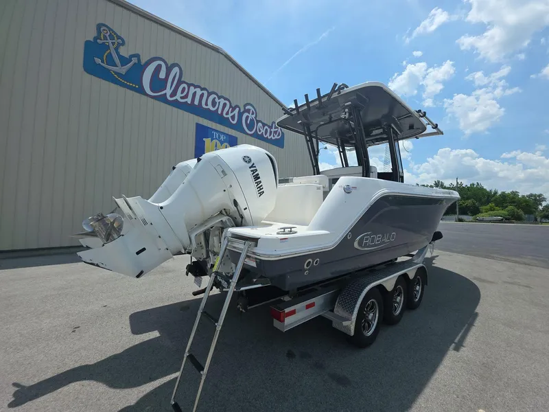 Slide: The Image of 2021 Robalo R272 Center Console boat with Yamaha engines on a trailer. - 3