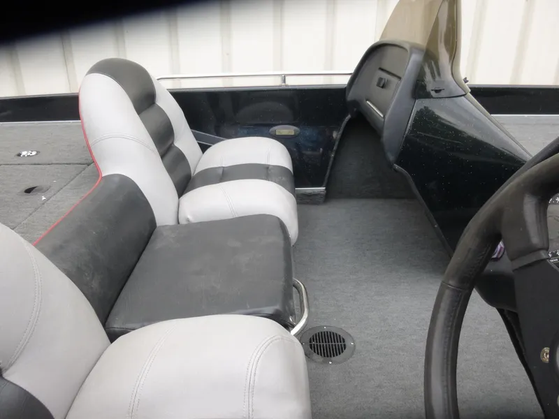 Slide: The Image of 1999 Viper Boats Cobra 180 interior with dual seats and steering wheel. - 11