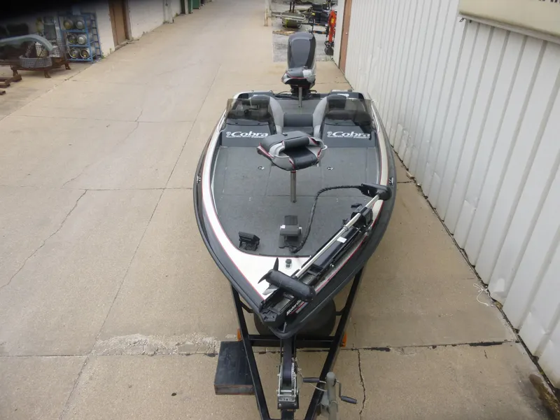 Slide: The Image of 1999 Viper Boats Cobra 180 on trailer, parked outdoors, featuring fishing seats and equipment. - 3