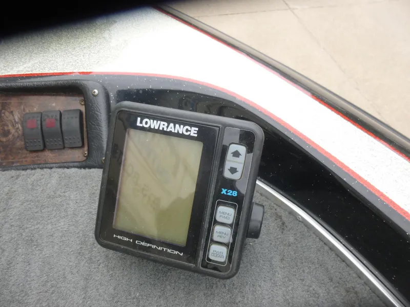Slide: The Image of Lowrance fish finder on 1999 Viper Boats Cobra 180 dashboard. - 7