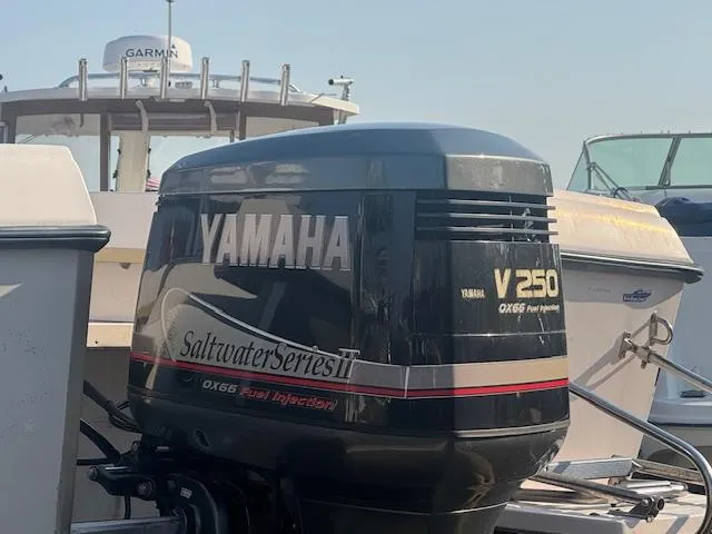 Slide: The Image of Yamaha V250 outboard motor on 1994 Grady-White Explorer 244 boat, docked with Garmin equipment. - 5
