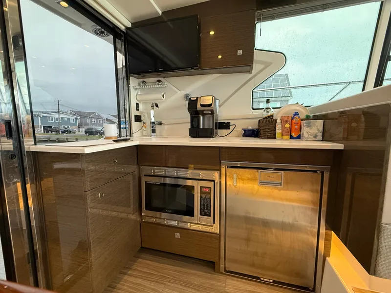 Slide: The Image of Luxurious 2018 Cruisers Yachts 42 Cantius galley with modern appliances and sleek design. - 32