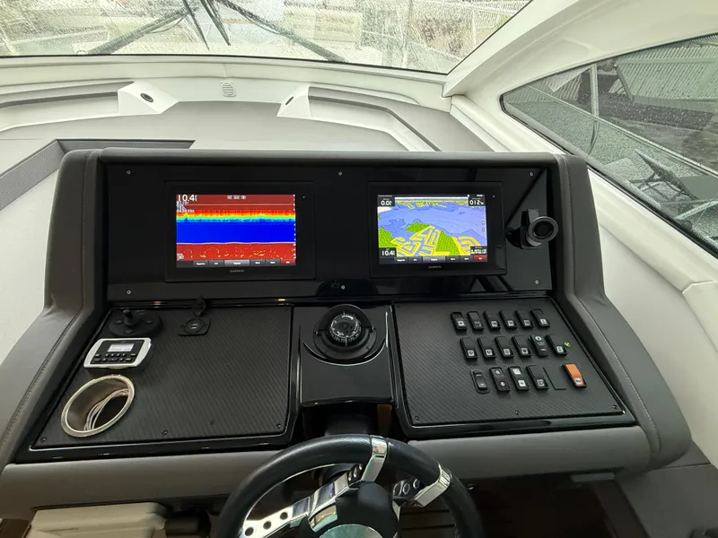 Slide: The Image of Helm of 2018 Cruisers Yachts 42 Cantius with navigation displays and controls. - 35