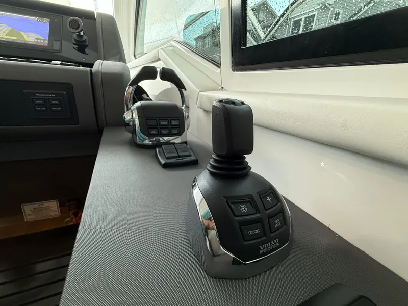 Slide: The Image of Control panel of 2018 Cruisers Yachts 42 Cantius with joystick and navigation system. - 36