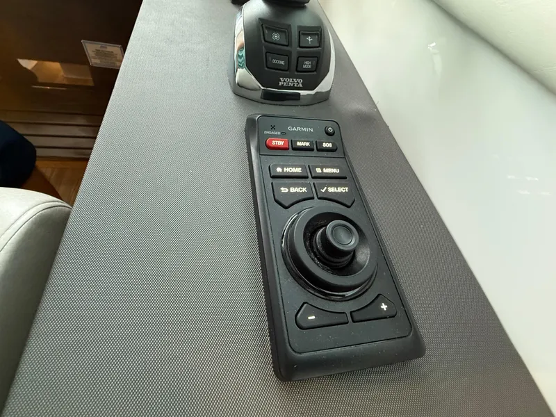 Slide: The Image of Control panel of 2018 Cruisers Yachts 42 Cantius with joystick and buttons. - 38