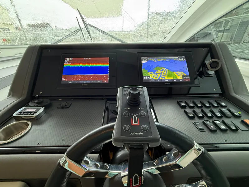 Slide: The Image of Helm of 2018 Cruisers Yachts 42 Cantius with navigation screens and controls. - 42