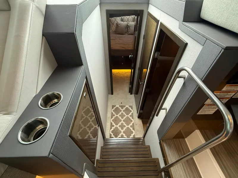 Slide: The Image of Interior view of 2018 Cruisers Yachts 42 Cantius, featuring stairs and modern design. - 43