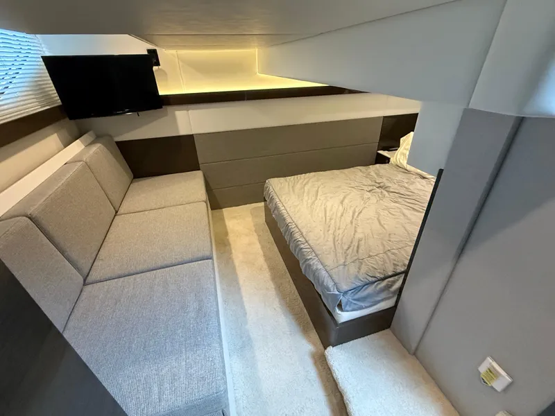Slide: The Image of Luxurious interior of 2018 Cruisers Yachts 42 Cantius with bed, sofa, and TV. - 45