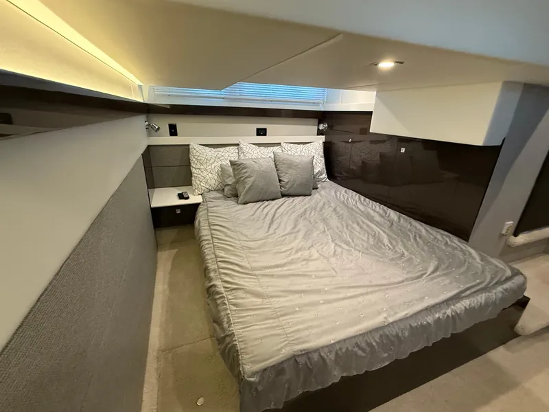 Slide: The Image of Luxurious bedroom interior of 2018 Cruisers Yachts 42 Cantius with modern design and cozy bedding. - 48