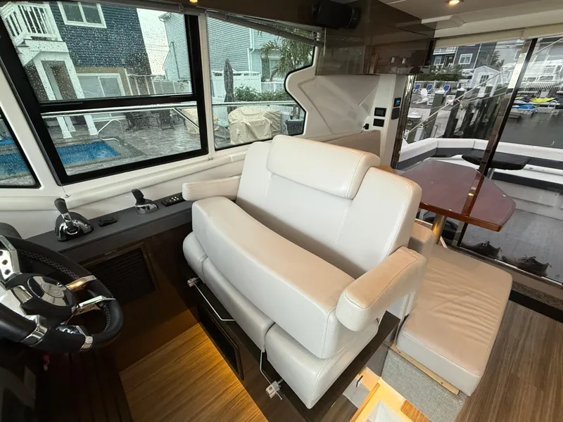 Slide: The Image of Interior of 2018 Cruisers Yachts 42 Cantius with helm and seating area. - 34