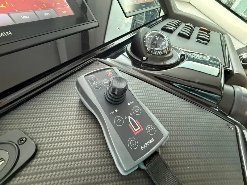 Slide: The Image of Control panel of 2018 Cruisers Yachts 42 Cantius with joystick and compass. - 40