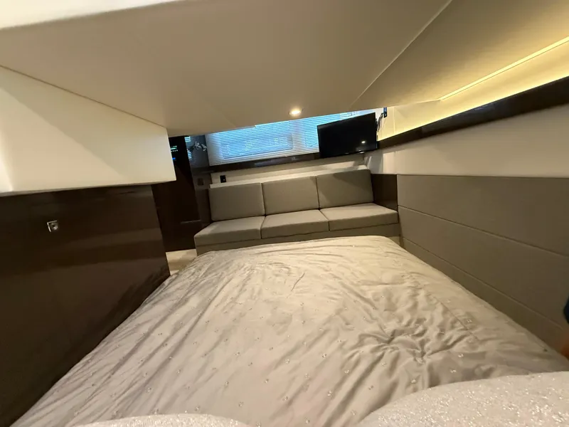 Slide: The Image of Luxurious interior of 2018 Cruisers Yachts 42 Cantius with cozy bed and seating area. - 49