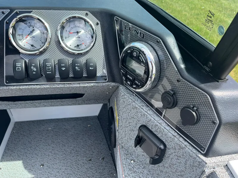 Slide: The Image of Dashboard of 2026 Lund 1675 Adventure Sport boat with gauges and controls. - 10