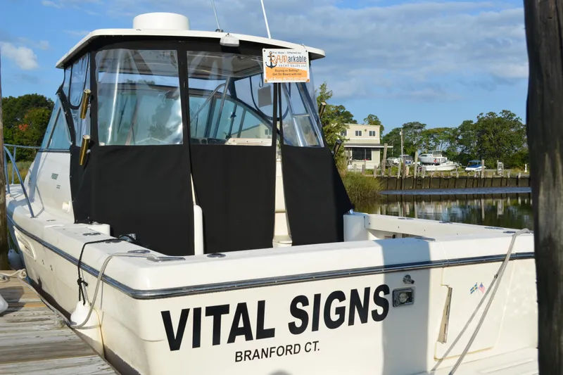 Slide: The Image of 2003 Pursuit 3000 Express boat named "Vital Signs" docked in Branford, CT. - 3