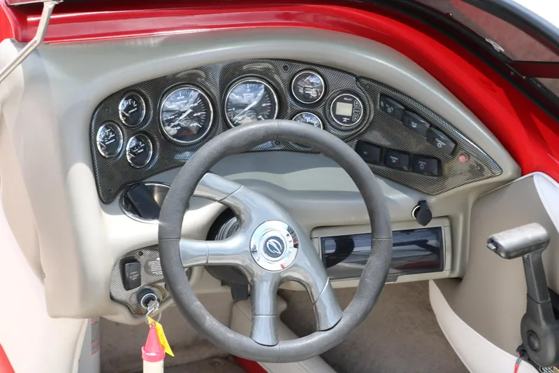 Slide: The Image of 2006 Crownline 21 SS-LPX boat dashboard with steering wheel and instrument panel. - 12