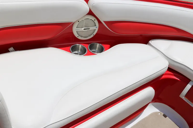 Slide: The Image of 2006 Crownline 21 SS-LPX boat interior with red and white seating, cup holders, and speaker. - 18