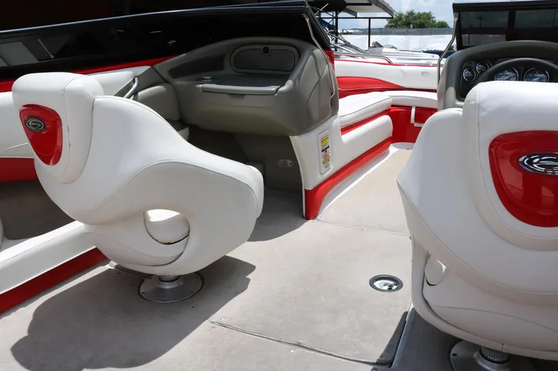 Slide: The Image of Interior of a 2006 Crownline 21 SS-LPX boat with white and red seating. - 21