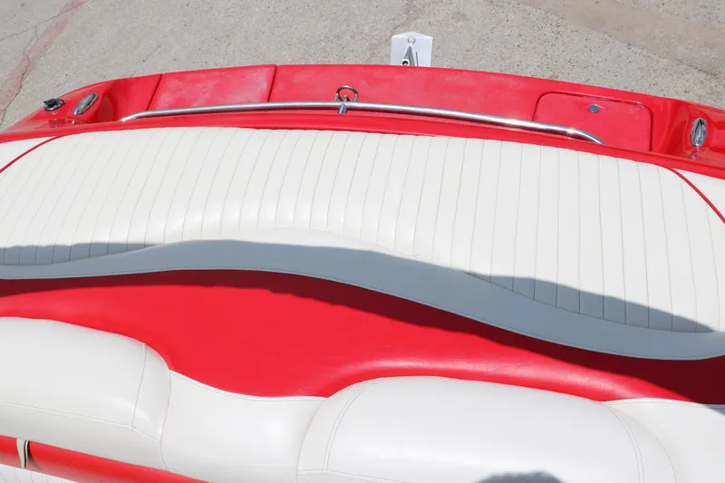 Slide: The Image of 2006 Crownline 21 SS-LPX boat with red and white seating, sleek design. - 23