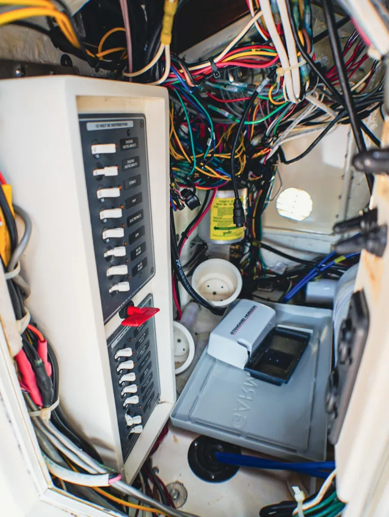 Slide: The Image of Electrical panel and wiring inside a 1969 SeaCraft Potter hull boat. - 13