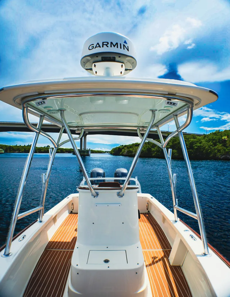 Slide: The Image of 1969 SeaCraft Potter hull boat with Garmin equipment on a scenic waterway. - 4