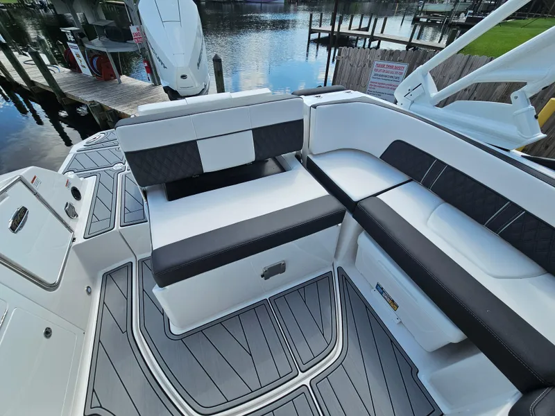 Slide: The Image of 2025 Monterey M-45 boat interior with sleek seating and modern design by the water. - 10