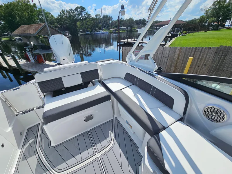 Slide: The Image of 2025 Monterey M-45 boat interior with sleek seating and waterfront view. - 15