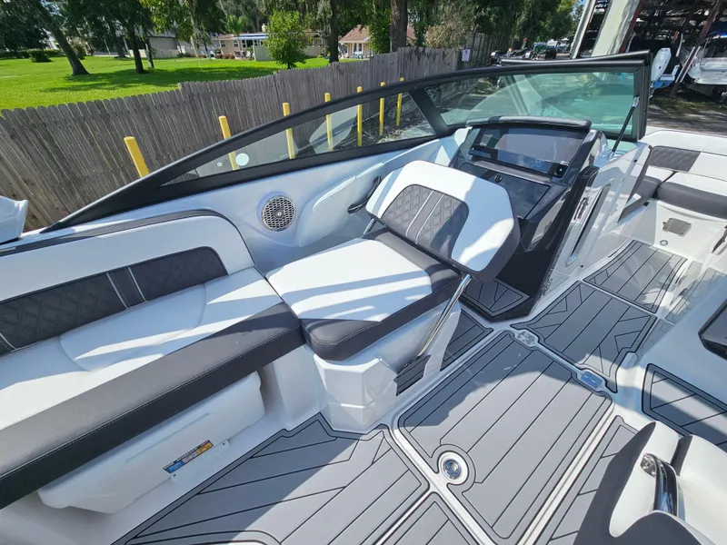 Slide: The Image of 2025 Monterey M-45 boat interior with sleek seating and modern dashboard design. - 16