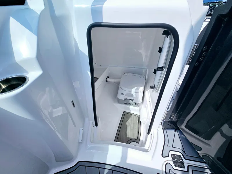 Slide: The Image of 2025 Monterey M-45 boat interior with compact marine toilet. - 19