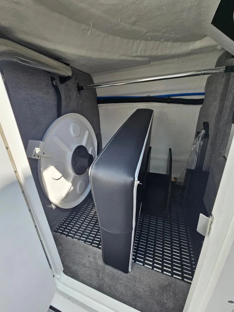 Slide: The Image of Interior of 2025 Monterey M-45 boat, featuring storage space and seating arrangement. - 25