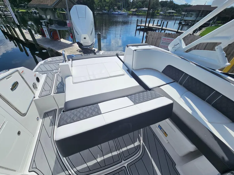Slide: The Image of Luxury seating on a 2025 Monterey M-45 boat, docked by a serene waterfront. - 9