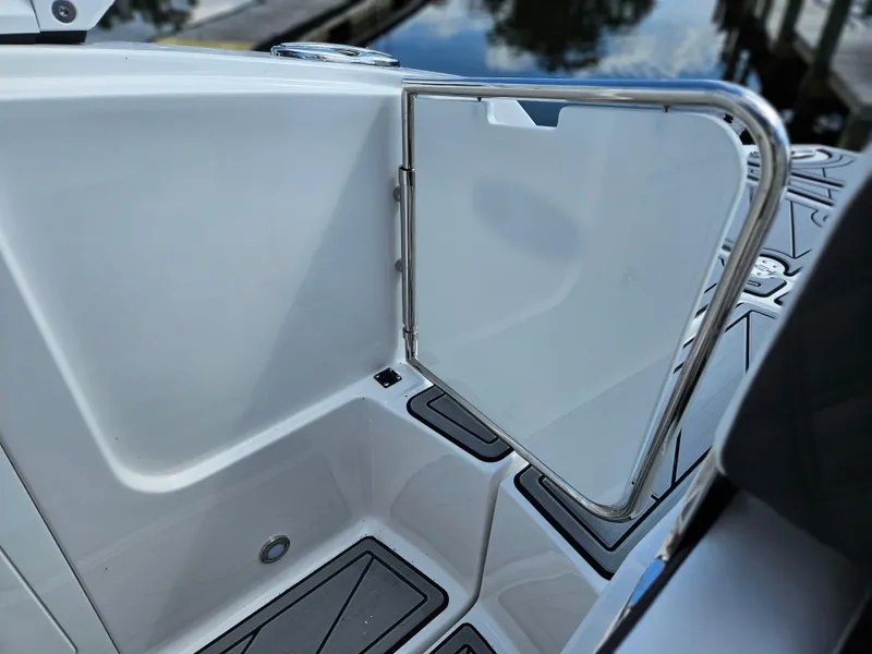 Slide: The Image of Monterey M-45 2025 boat with open stainless steel gate, dockside view. - 14