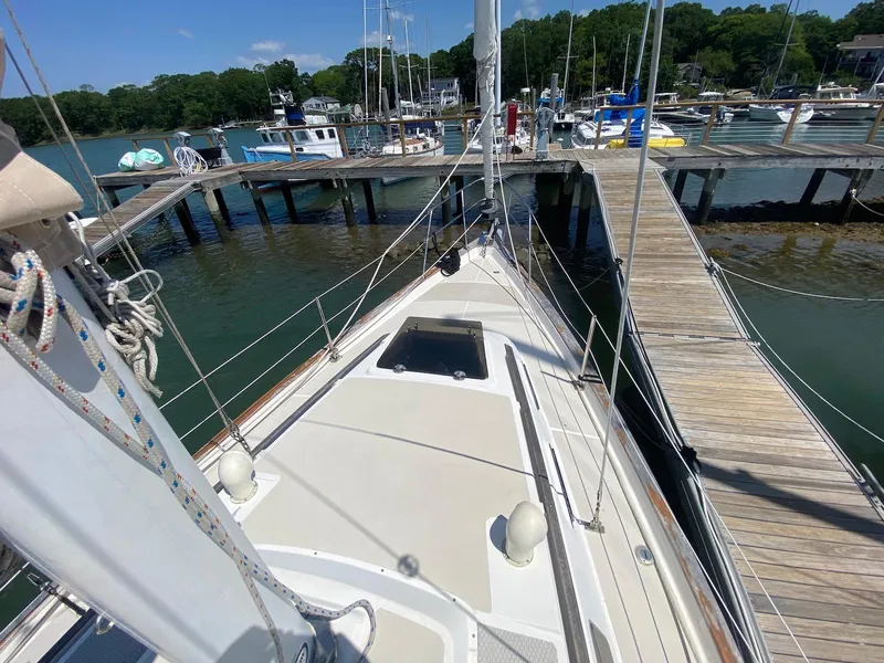 Slide: The Image of 1986 S2 11 Center Cockpit sailboat docked at a marina, sunny day. - 18