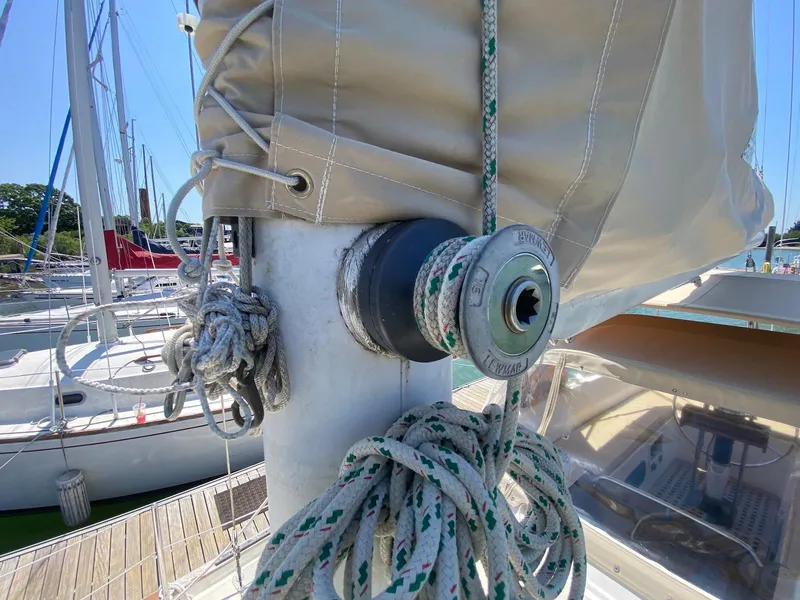 Slide: The Image of Close-up of 1986 S2 11 Center Cockpit sailboat mast with ropes and winch. - 20