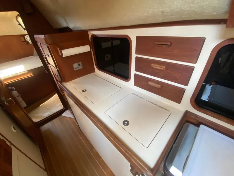 Slide: The Image of 1986 S2 11 Center Cockpit interior with wooden cabinetry and storage compartments. - 28