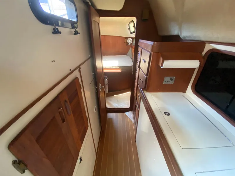 Slide: The Image of 1986 S2 11 Center Cockpit interior with wood accents and compact layout. - 29