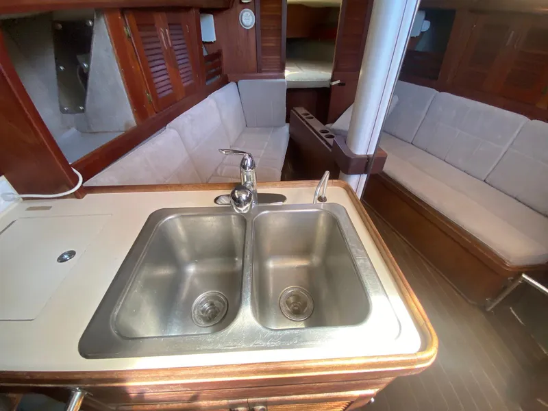 Slide: The Image of Interior of 1986 S2 11 Center Cockpit yacht with double sink and seating area. - 36