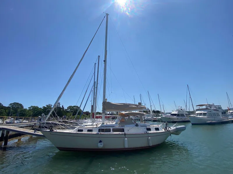Slide: The Image of 1986 S2 11 Center Cockpit sailboat docked in sunny marina. - 5