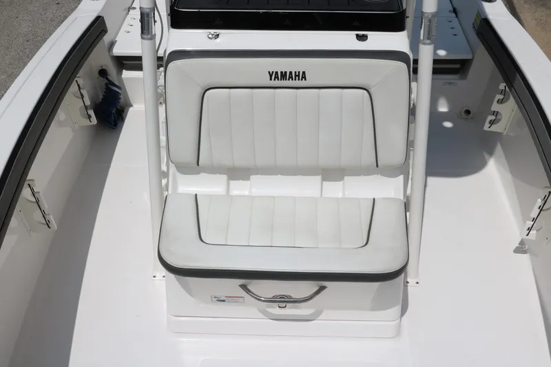 Slide: The Image of 2018 Yamaha Boats 190 FSH Sport interior seating, white upholstery, sleek design. - 16