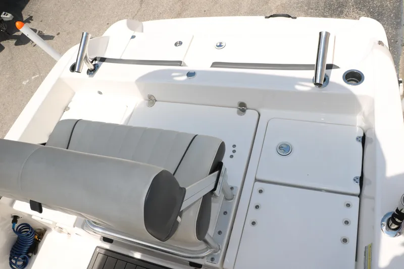 Slide: The Image of 2018 Yamaha Boats 190 FSH Sport interior with seating and storage compartments. - 22