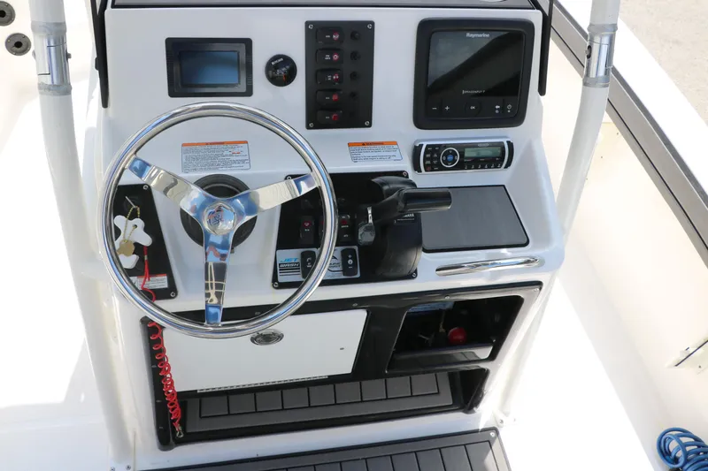 Slide: The Image of 2018 Yamaha Boats 190 FSH Sport dashboard with steering wheel and control panel. - 23