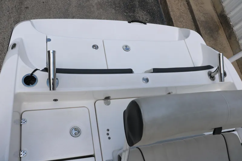 Slide: The Image of 2018 Yamaha Boats 190 FSH Sport, rear deck view with seating and storage compartments. - 29