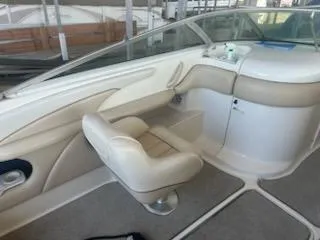 Slide: The Image of 1996 Sea Ray 260 Bow Rider Select interior with beige seating and sleek design. - 5