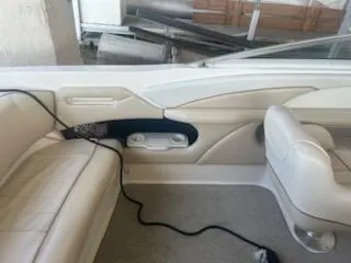 Slide: The Image of 1996 Sea Ray 260 Bow Rider Select interior with beige seating and clean design. - 6