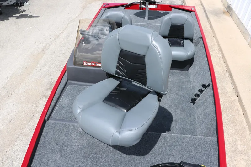 Slide: The Image of 2023 Bass Tracker Classix XL boat interior with gray seats and red trim. - 12