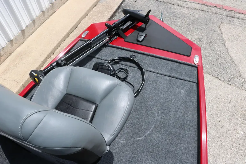 Slide: The Image of 2023 Bass Tracker Classix XL boat with gray seat and red trim. - 13
