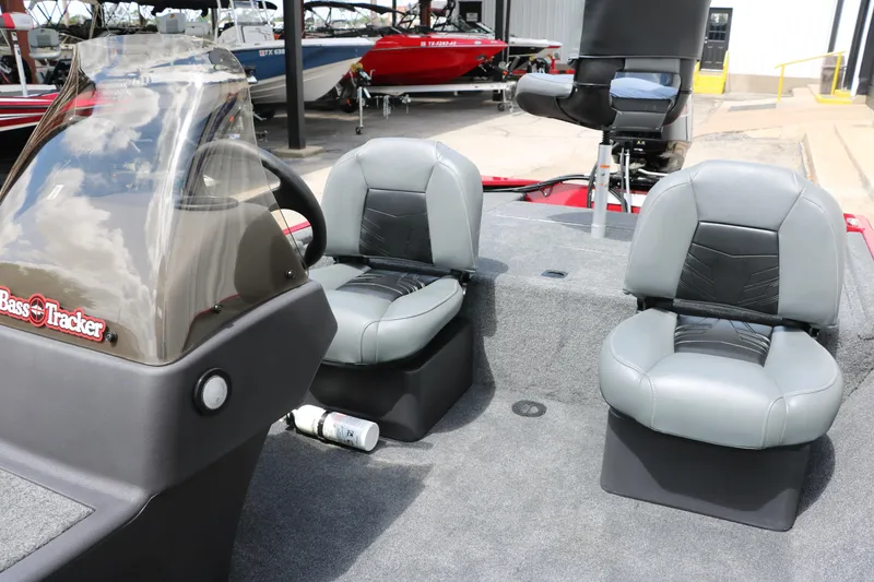 Slide: The Image of 2023 Bass Tracker Classix XL boat interior with gray seats and steering console. - 17