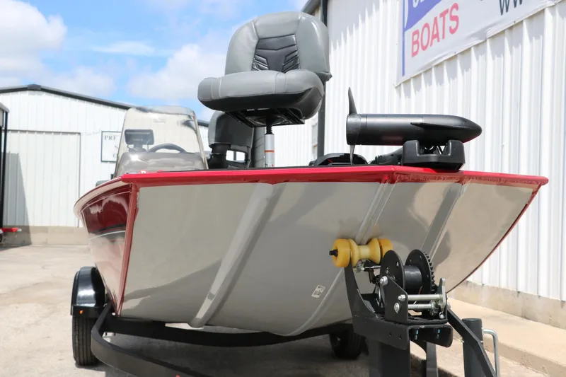 Slide: The Image of 2023 Bass Tracker Classix XL boat on trailer, parked outdoors. - 6