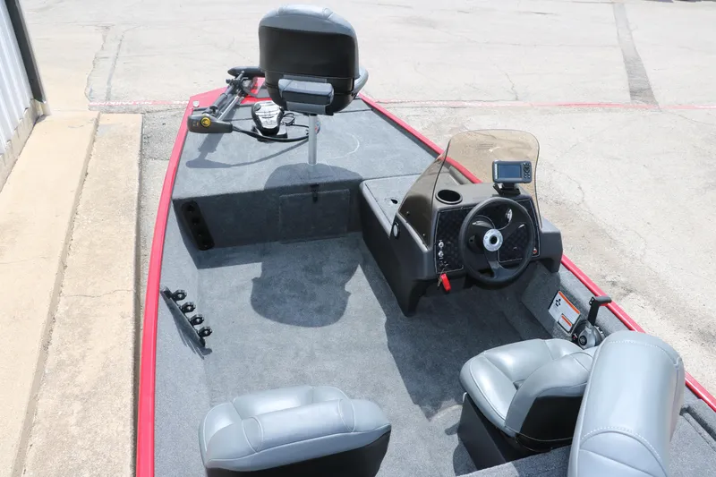 Slide: The Image of 2023 Bass Tracker Classix XL boat interior with steering console and seating. - 8