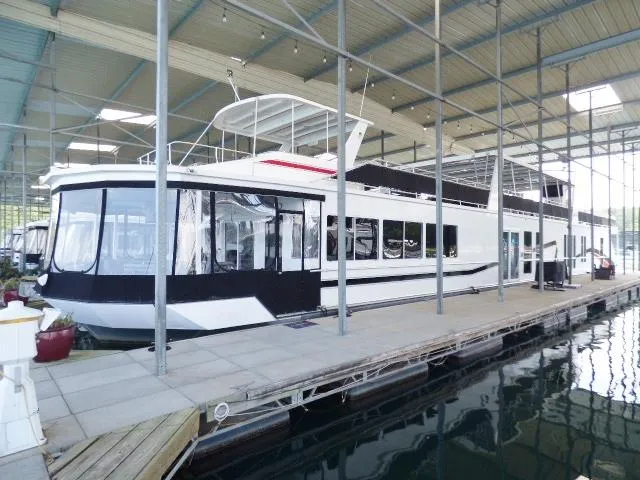 The Image of Houseboat docked in a covered marina, Fantasy 19x112 model, 2007. - 0